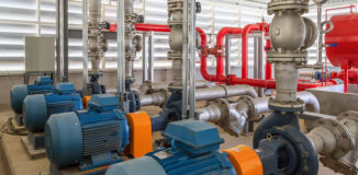 Industrial fire pump station for water sprinkler piping and fire alarm control system. Pipelines water pump valves manometers